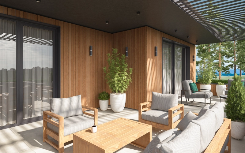 Hell geflieste Terrasse mit Loungemöbeln aus Holz mit grau-weiß gestreiften Kissenbezügen.