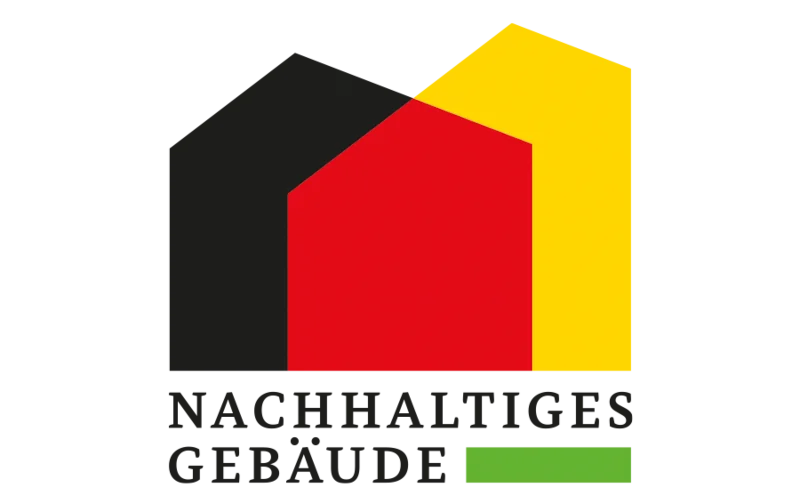Siegel nachhaltiges Gebäude mit Häuser-Umrissen in Deutschlandfarben