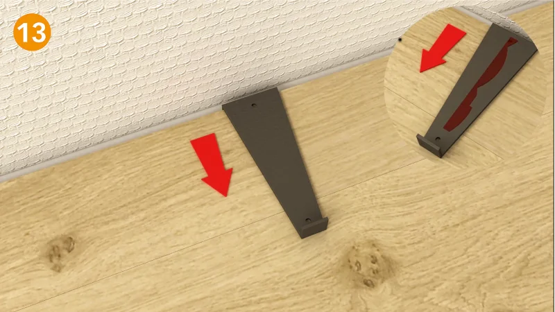 Installationsschritt für Bodenleiste mit roter Pfeilanweisung.