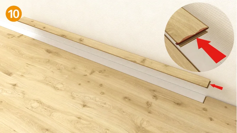 Installationsanleitung für Laminatboden mit roter Pfeilmarkierung.