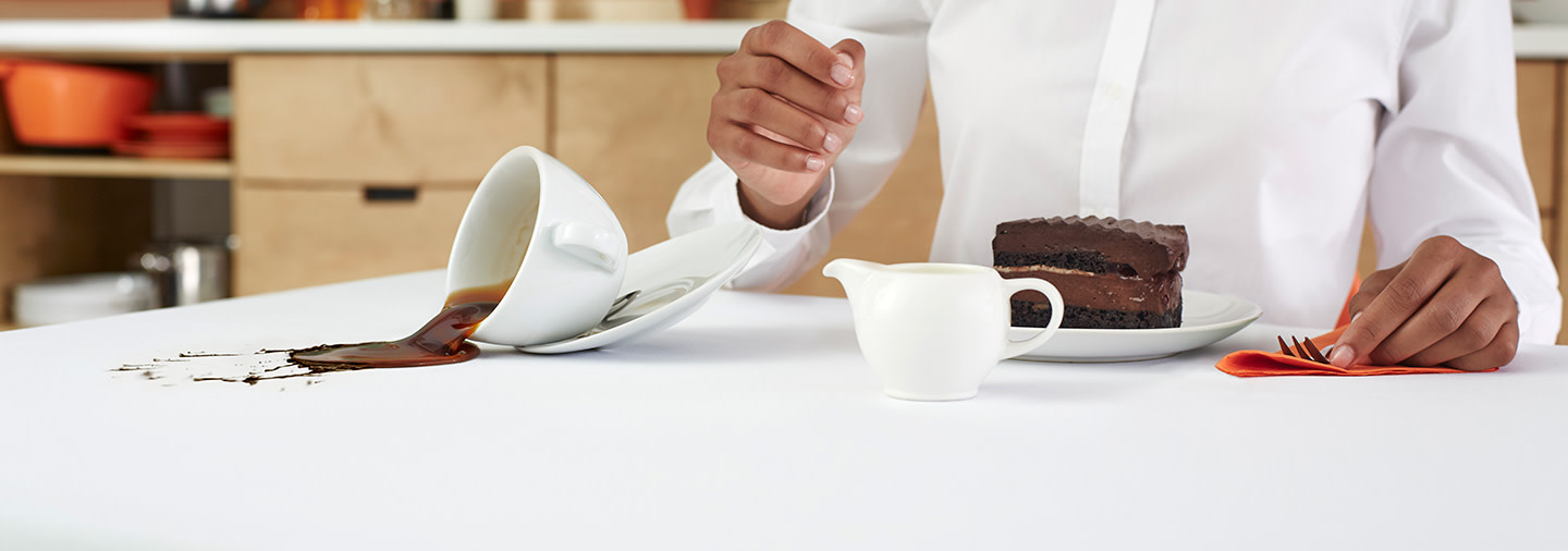 A white tablecloth stained with coffee
