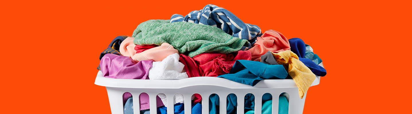 A laundry basket full of colorful garments