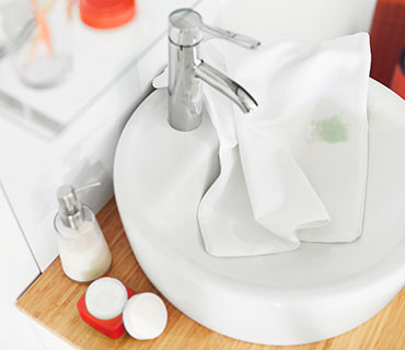 Stained white top in the sink