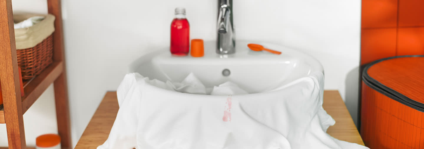Stained, white garment in the sink 