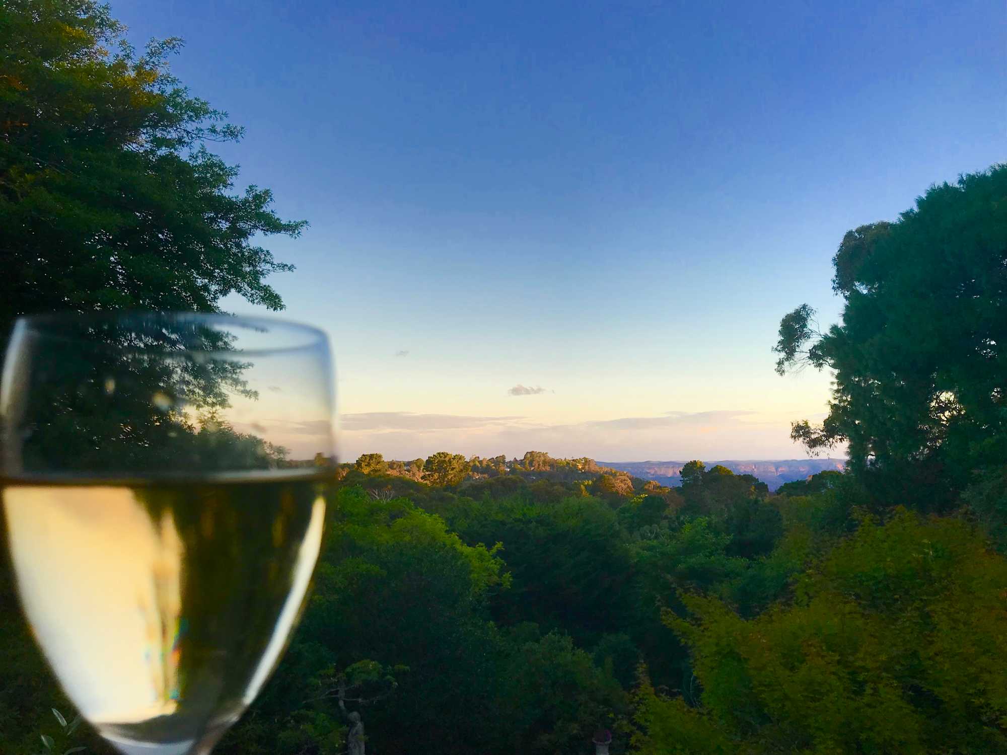 Enjoying the simply pleasures of wine whilst taking in the Jamison Valley at Chatelaine Luxury, Katoomba Blue Mountains