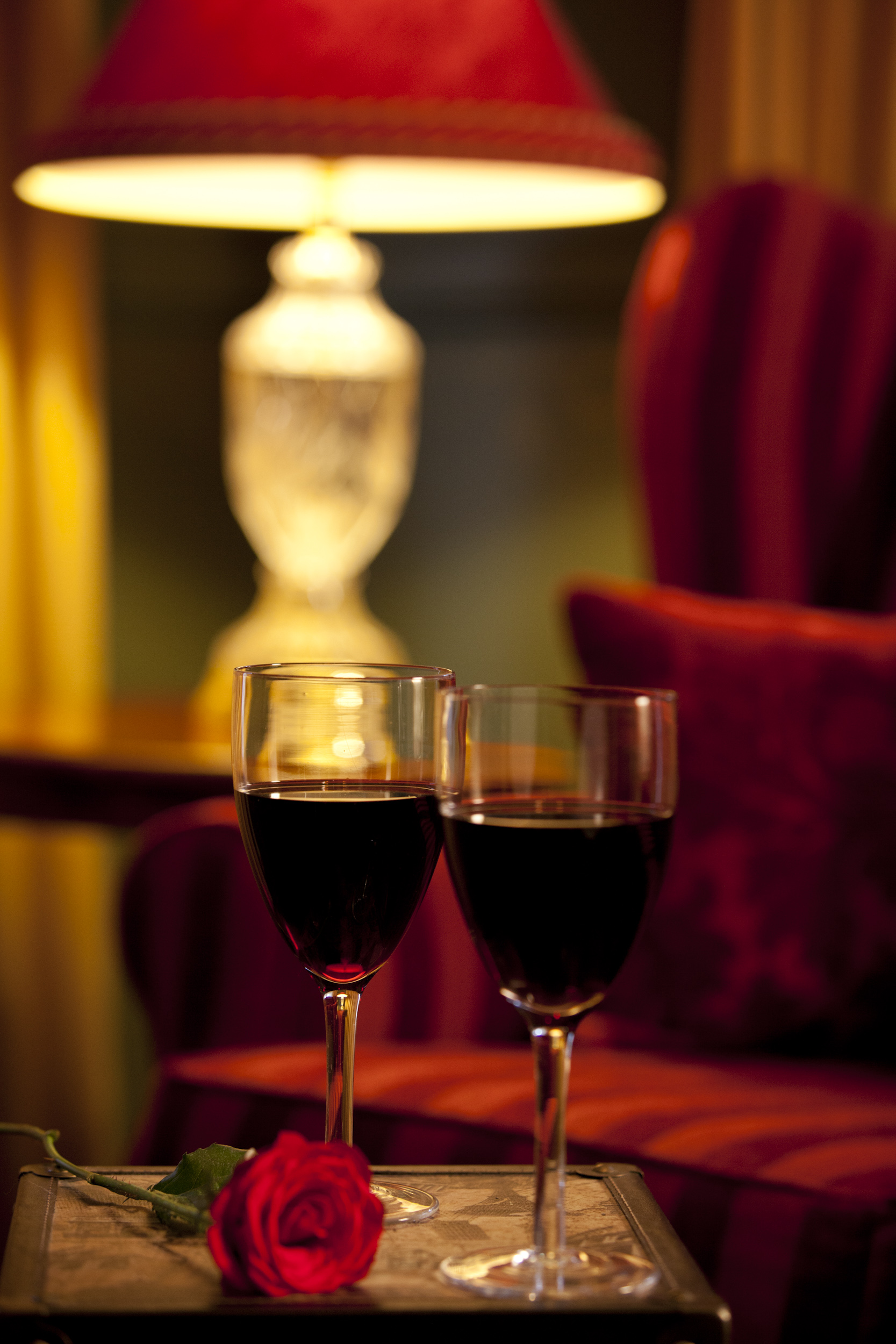 A glass of red wine by the fire at Strawberry Patch