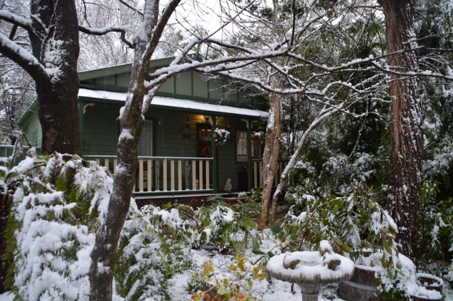 Exterior of a snow-covered Strawberry Patch Cottage