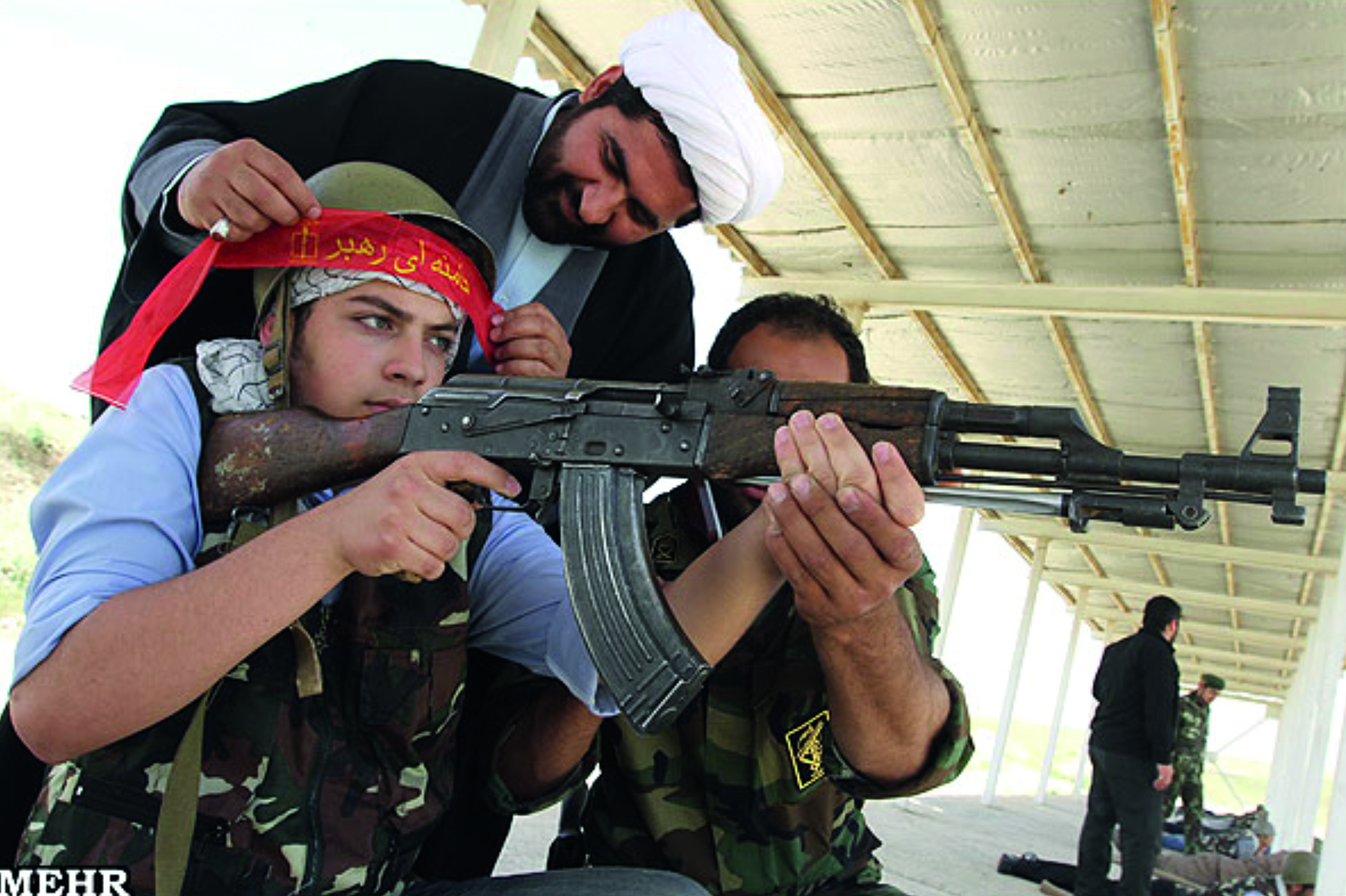 Figure 4: Basij Pupil Receiving Firearms Training from IRGC Member