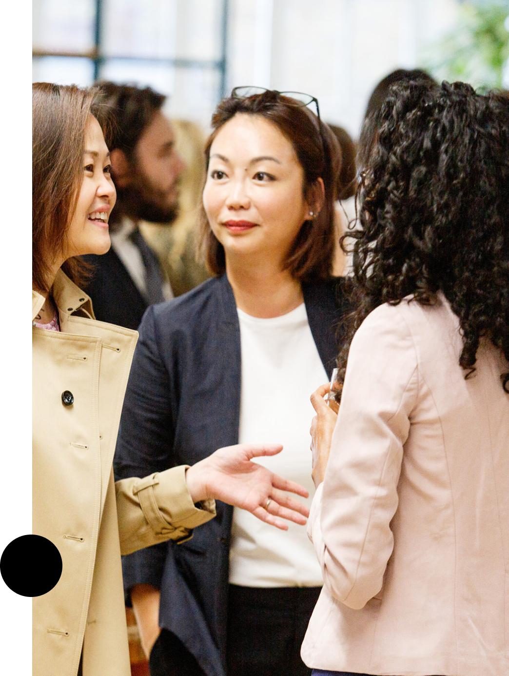 group of women talking at a reception