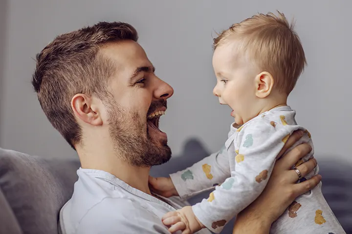 Dad playing with baby