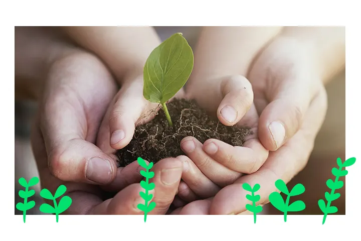 PARENTS AND BABY HOLDING SOIL IN THEIR HANDS