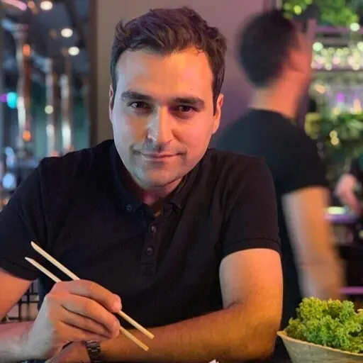 Kaan eats with chop sticks