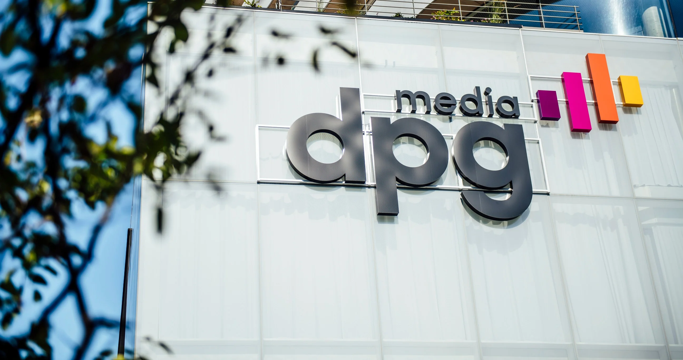 DPG Media logo on building
