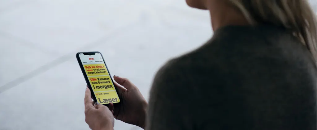 Woman reading B.T. on her mobile phone