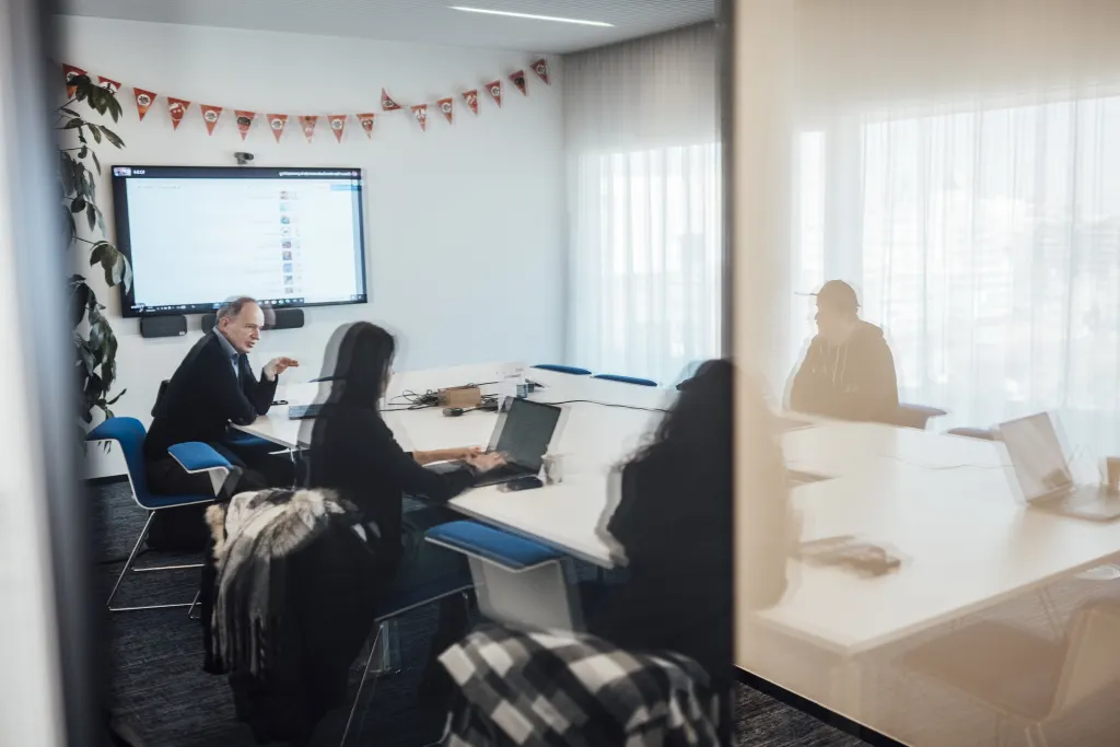 A group of people in a meeting