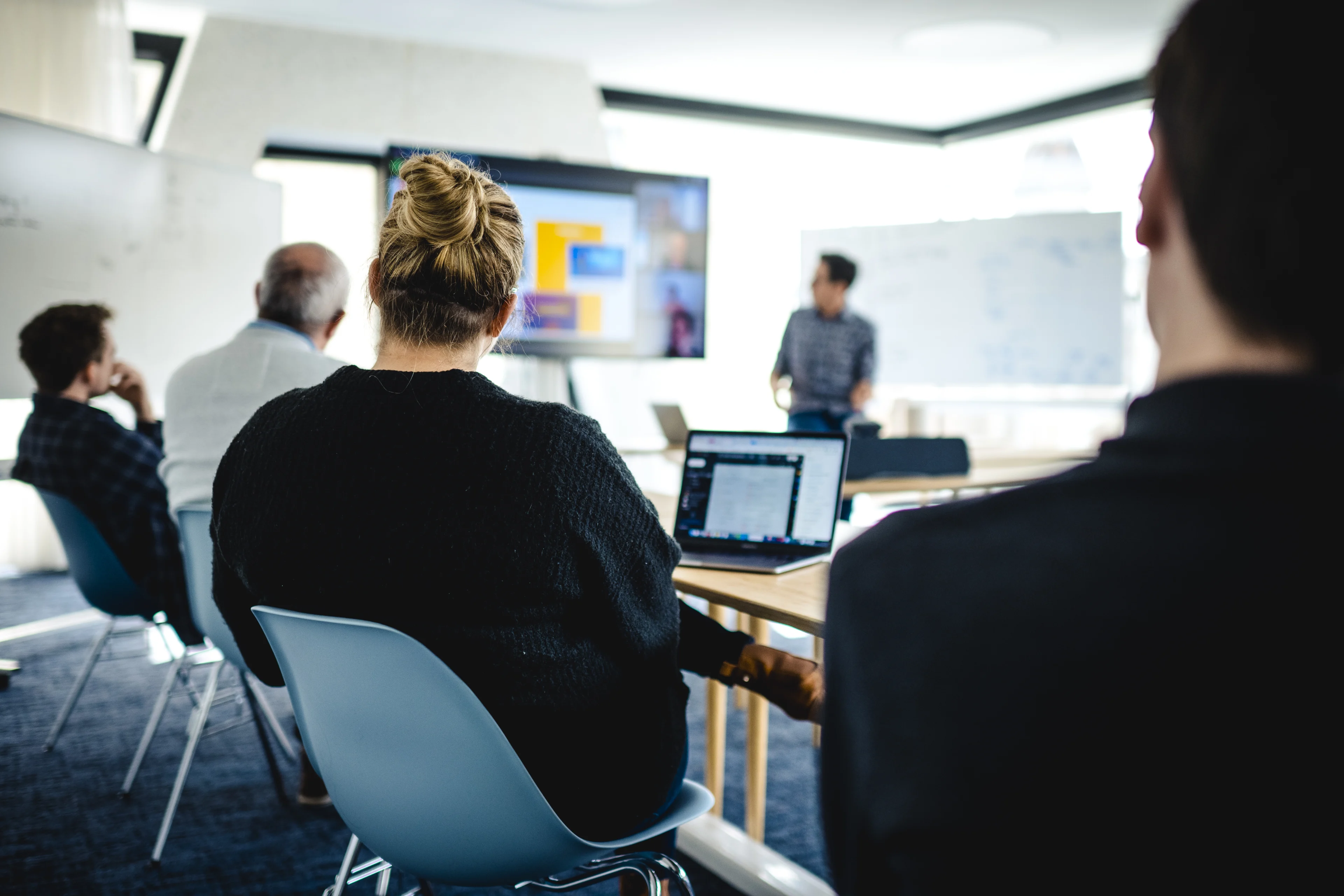 A group of people in a meeting