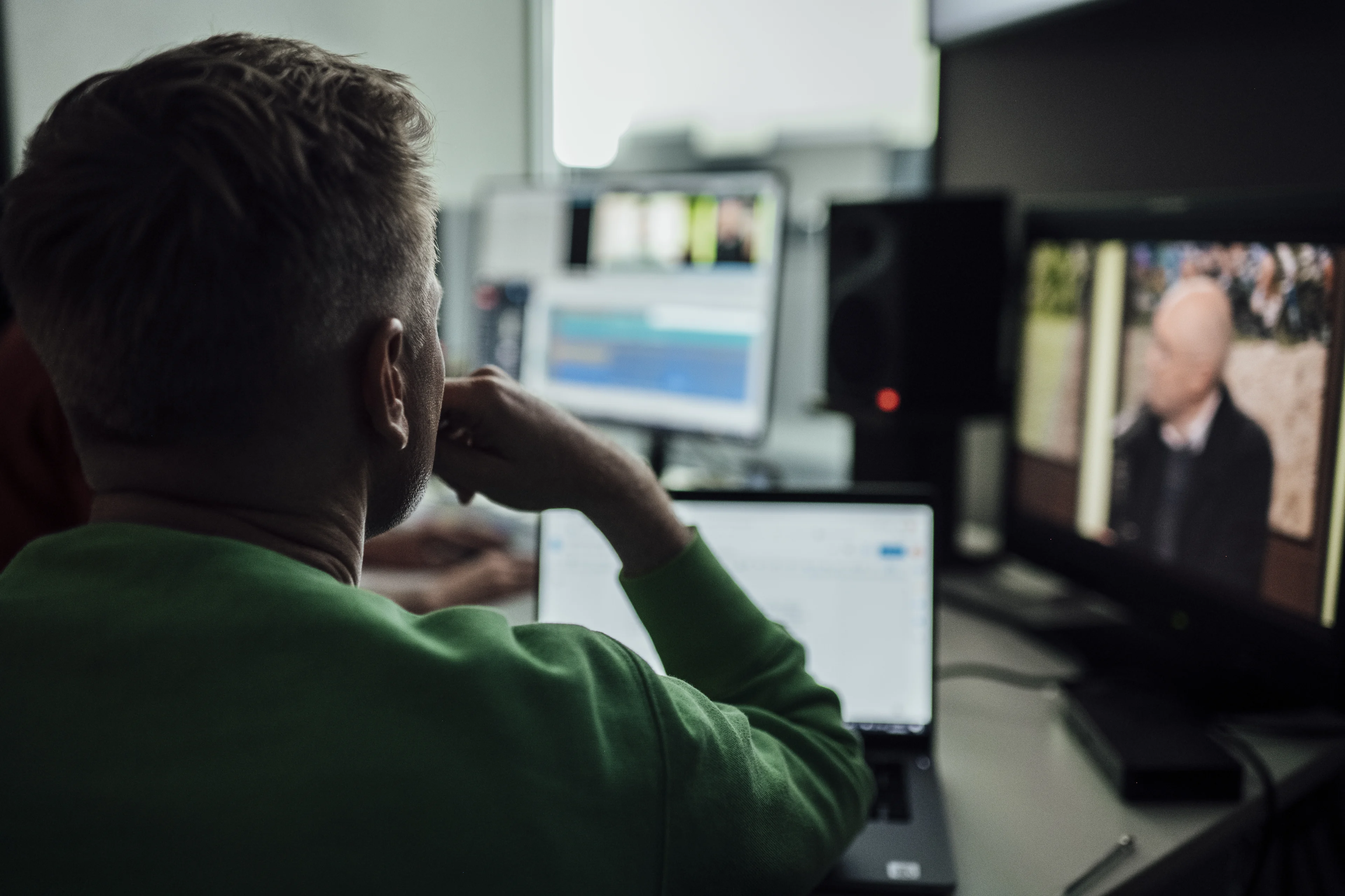 a man sitting in front of his computer