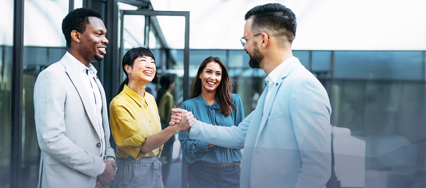 Two business people sitting at a meeting table.