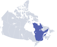 A grey map of Canada emphasizing Quebec in blue .