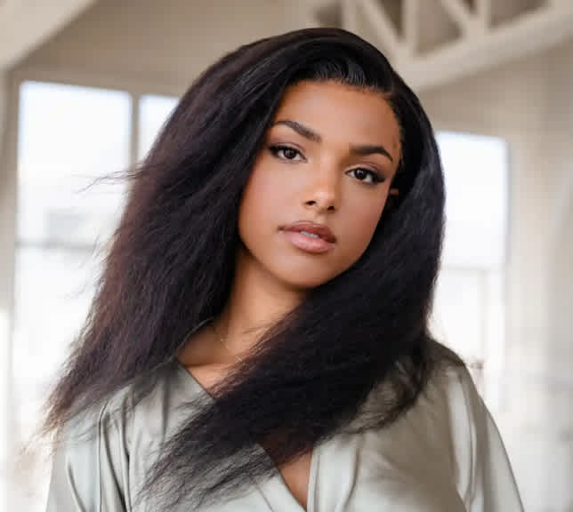 Lady wearing a long and thick natural textured wig.