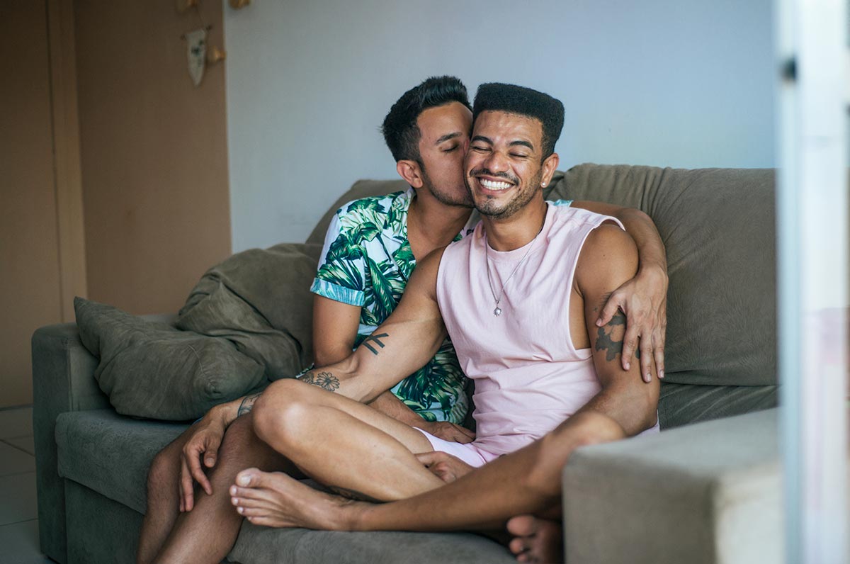 male-couple-snuggling-on-couch