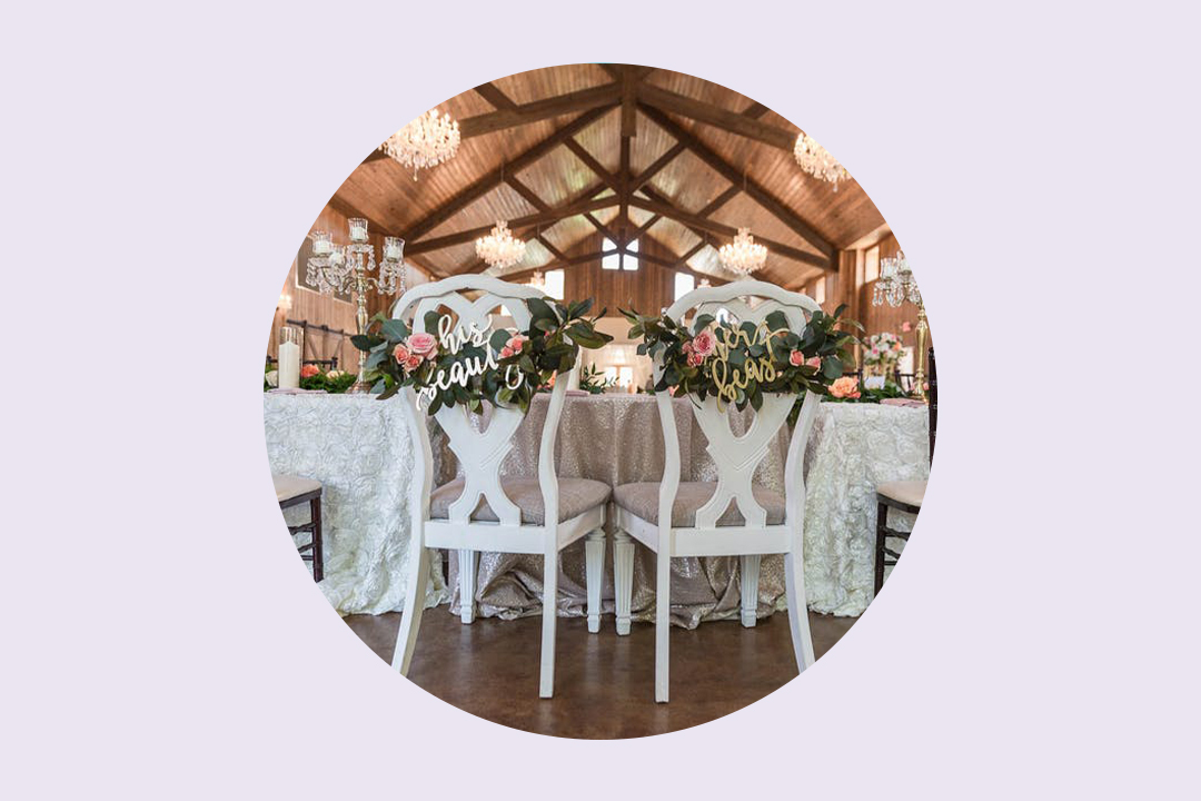 Rustic Table Decor with Wine Bottles, Roses, and Hydrangeas at The  Enchanted Barn