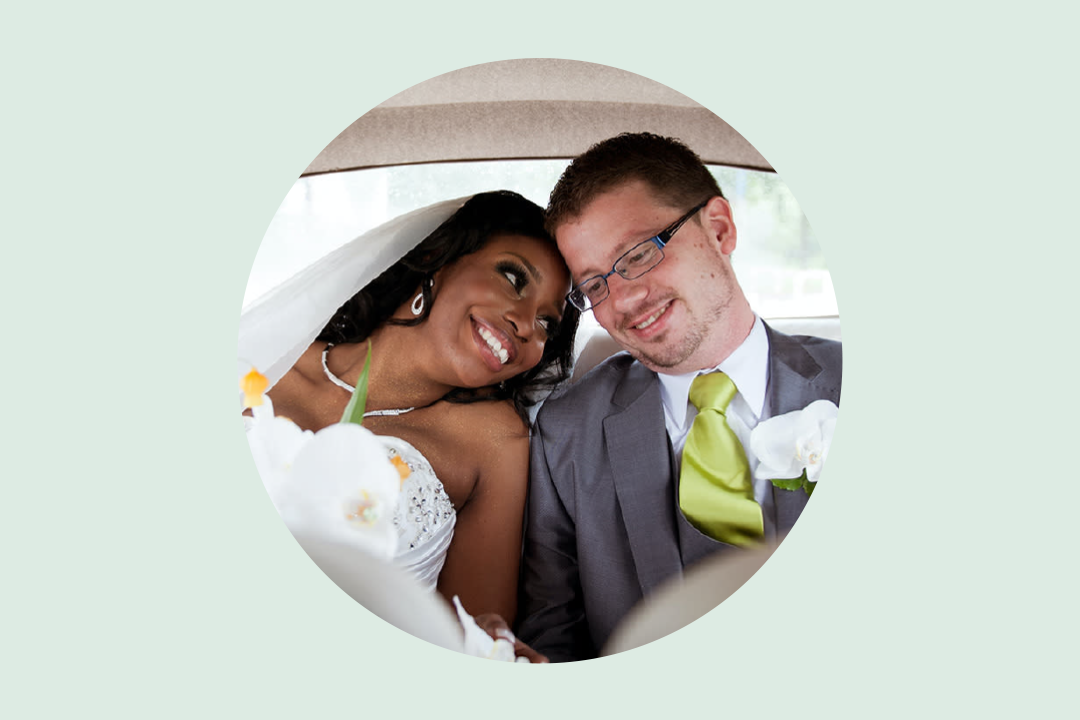 Couple together in car backseat