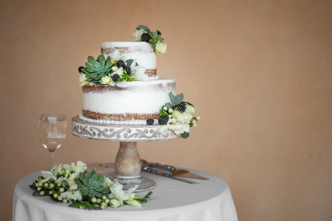 Candlestick and wedding cake cutting sword on the glass table next to the  stage in wedding ceremony. Wedding Ceremony tools and decorations concept  Stock Photo - Alamy