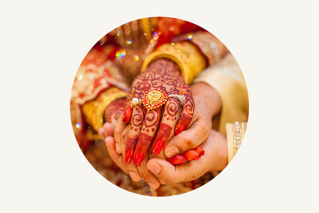 south asian indian wedding couple holding hands