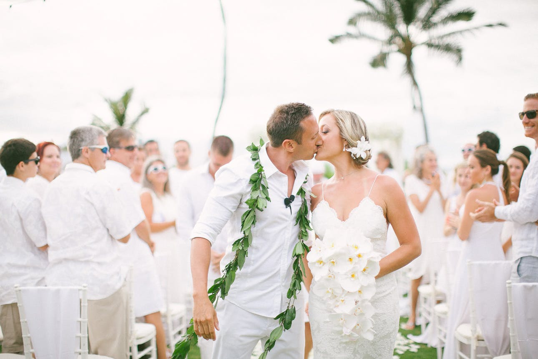 couple at all white wedding