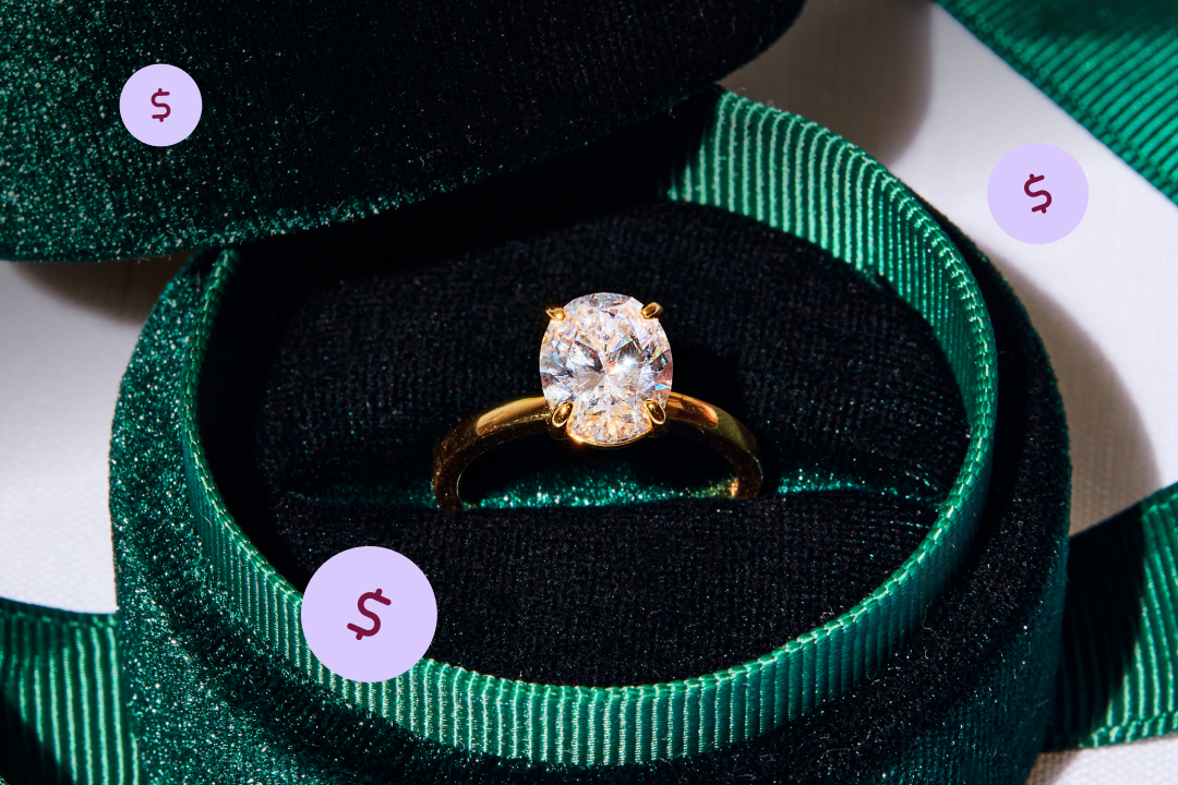 Oval engagement ring with a solitaire gold band in a green velvet ring box
