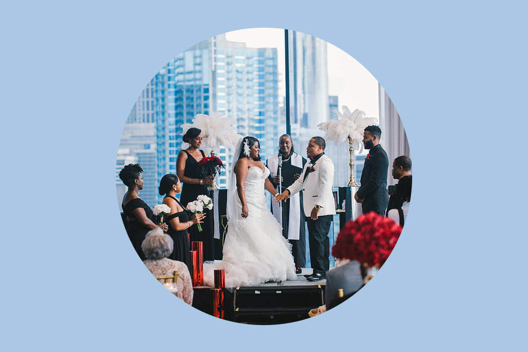 formal portrait of wedding party. Bride and bride maids with bouquet are sitting on stair in the front , Groom and groom men are standing at the back