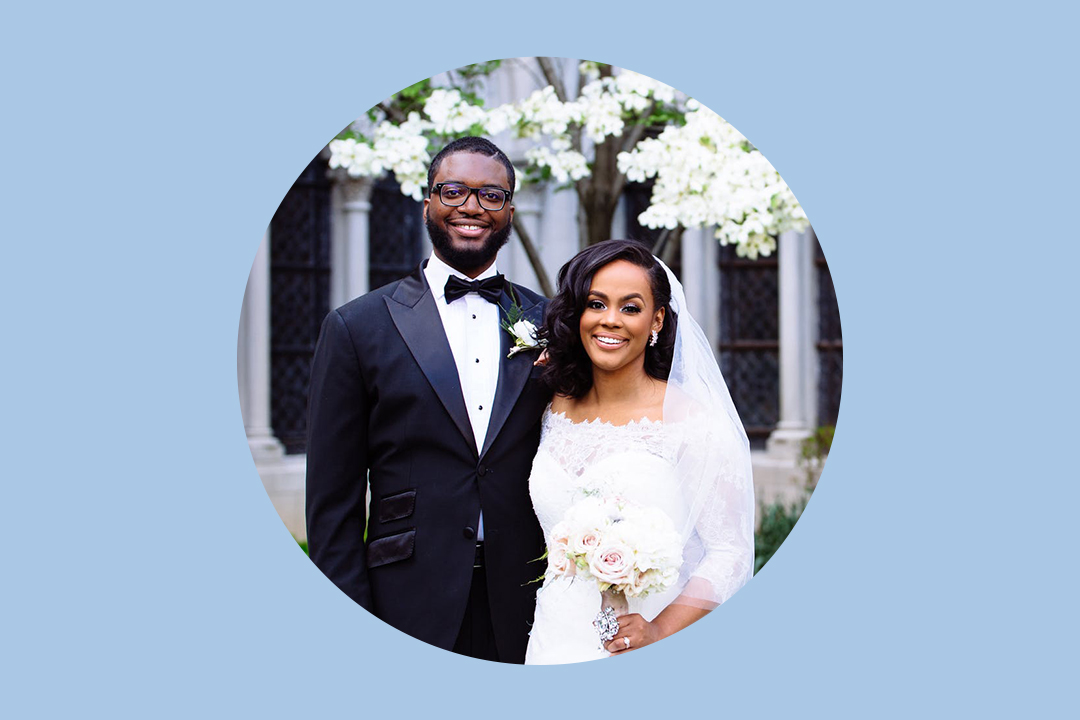 Bride and groom outdoors under a flowering tree at a garden wedding