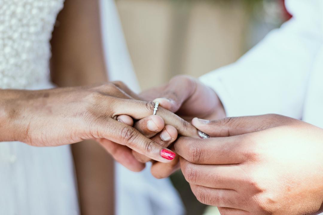 couple admiring engagement rings