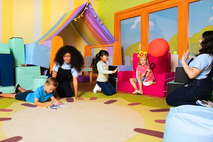 Children playing with CAMP Counselors inside Bluey's House at CAMP