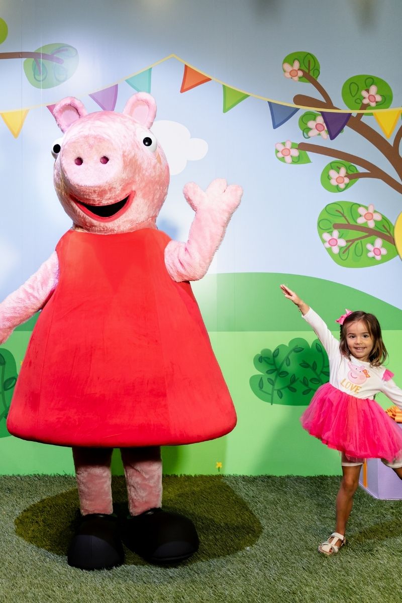 Child dancing with Peppa Pig at CAMP