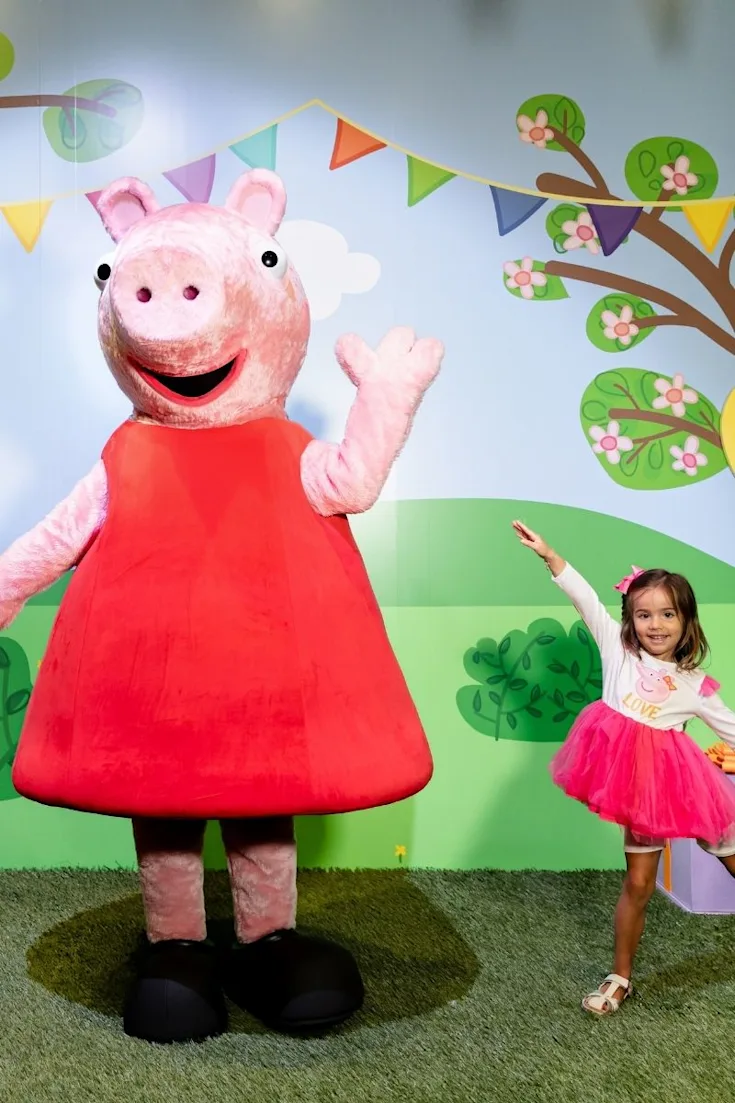 Child dancing with Peppa Pig at CAMP