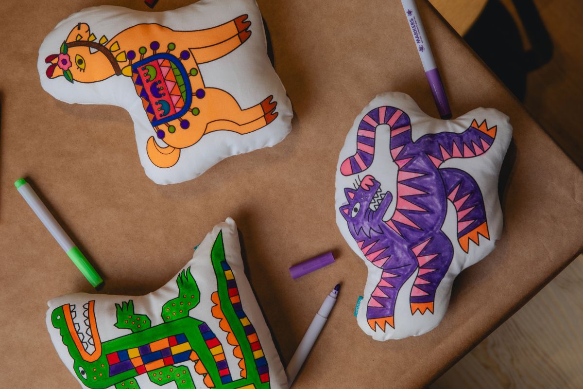 Overhead view of the plush pillow crafts at CAMP Maker Studio
