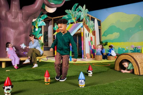 Child playing in Bluey's Backyard at CAMP