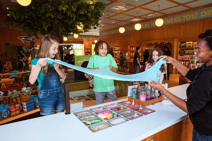 Busy CAMP store with kids making stretchy slime