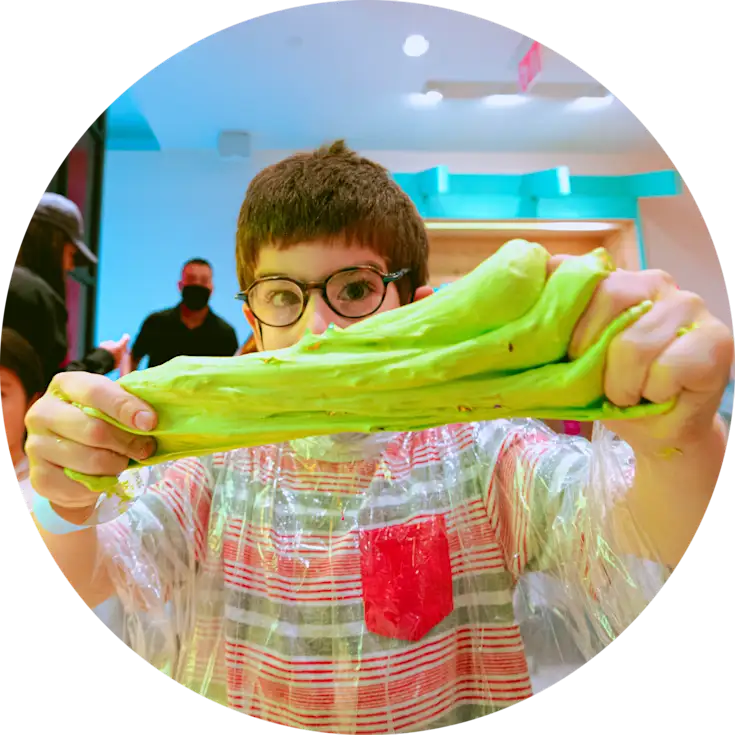 Boy making green slime at CAMP.