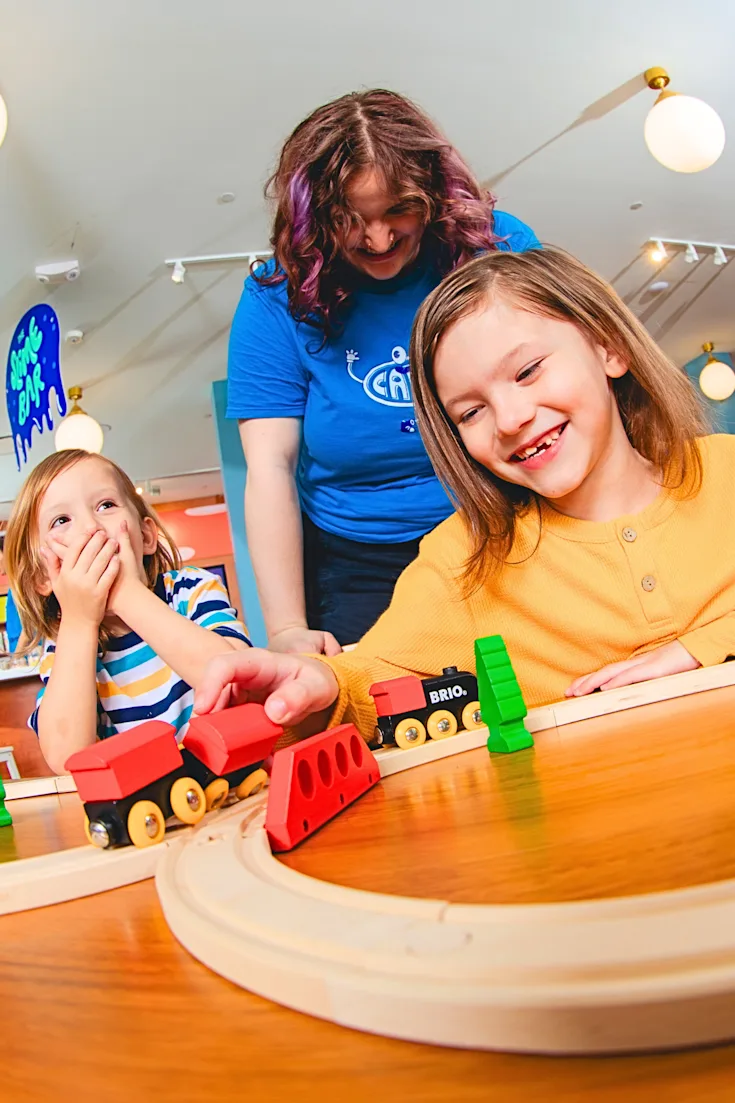 Kids inside CAMP trying out new toys