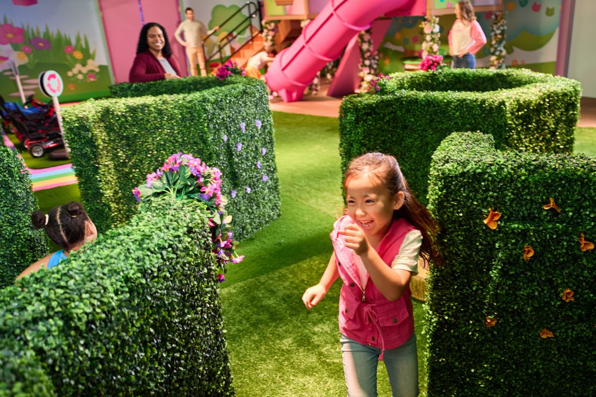 Girl running through the Fairy Tail Garden at Gabby's Dollhouse