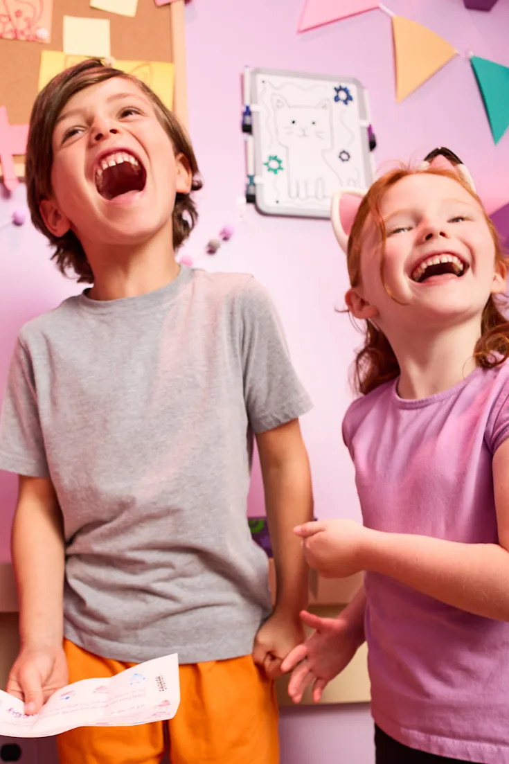 Kids discovering something fun inside a box