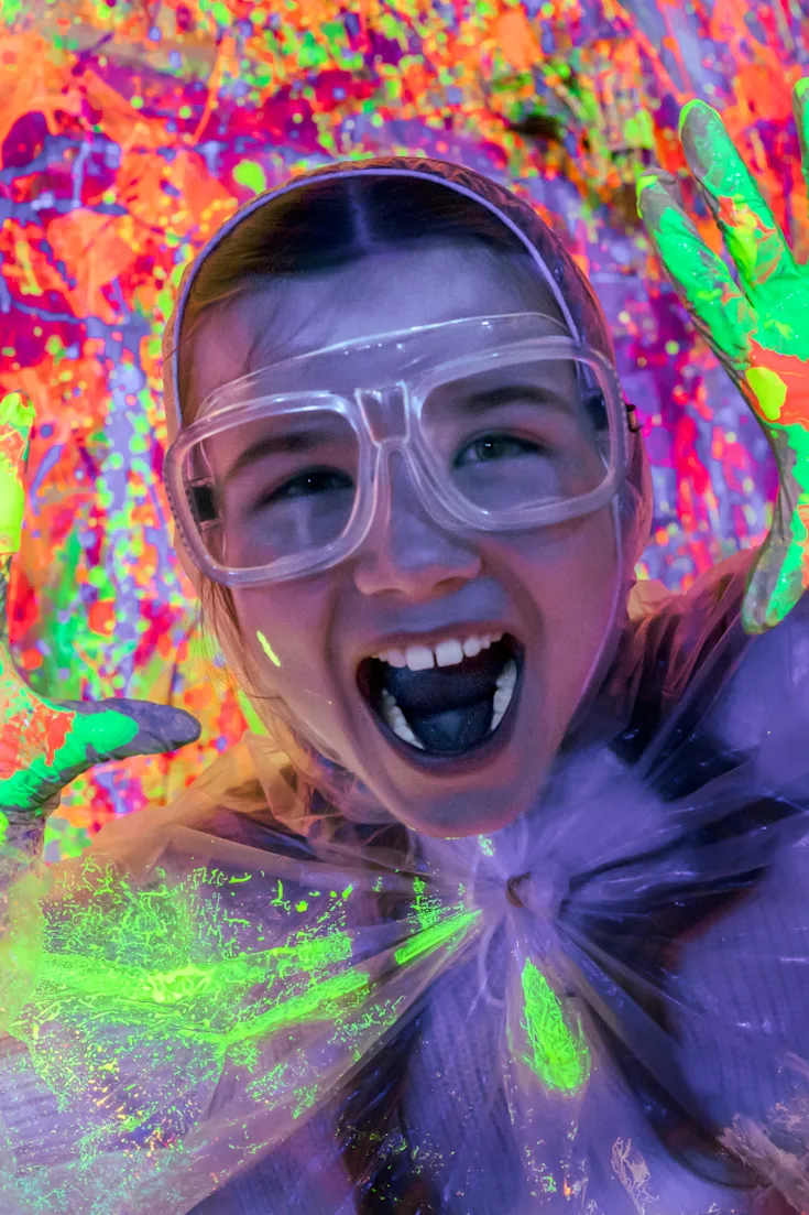 Little girl having maximum fun inside our Splatter Room Activity!