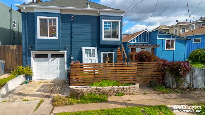 New James Hardie Evening Blue siding with Arctic White trim on a transformed Oakland home exterior