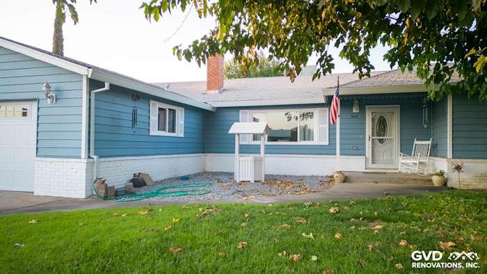 New Alside Prodigy vinyl siding in blue on a Yuba City home with decorative white trim and porch