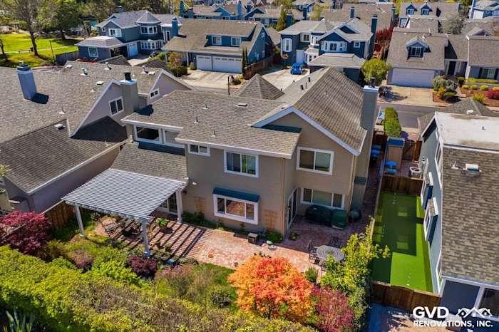 Home exterior featuring Monterey Taupe James Hardie Lap Siding and Arctic White trim in Foster City, CA