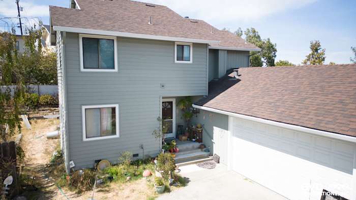 New Alside Prodigy vinyl siding in light gray, featuring five Mezzo windows on a two-story home in El Sobrante