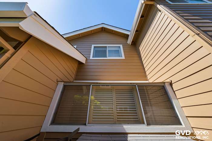 Khaki Brown James Hardie siding with Arctic White trim and new windows in Foster City, CA
